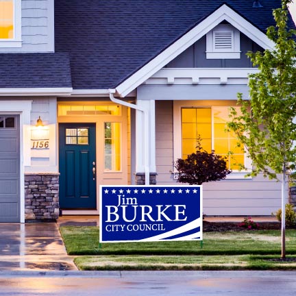 A custom campaign yard sign on the side of a road